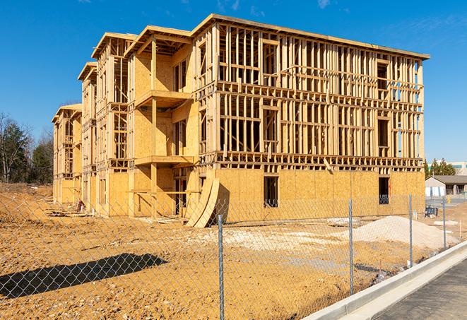 construction zone secured with a temporary fence, marked with warning signs in Montgomery IL